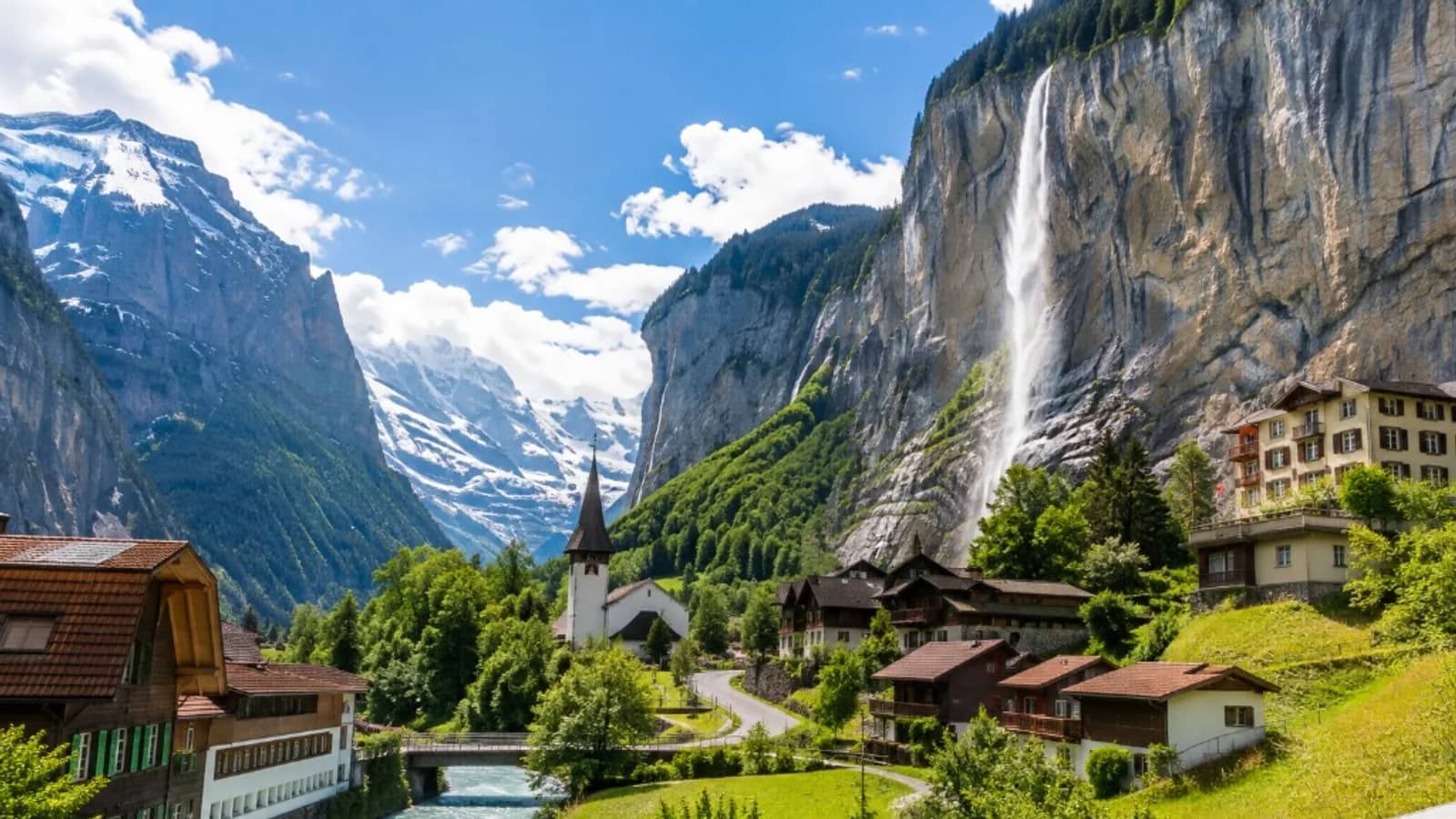An alpine village and waterfall in the Swiss mountains