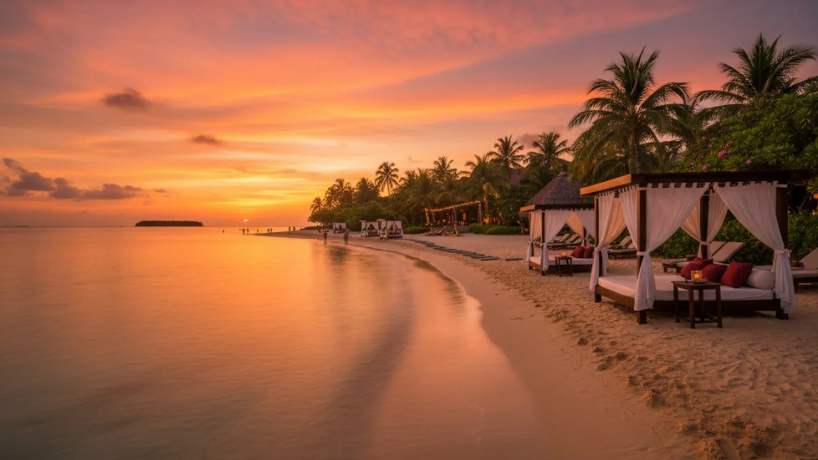 Luxury beach cabanas at sunset on a tropical shoreline